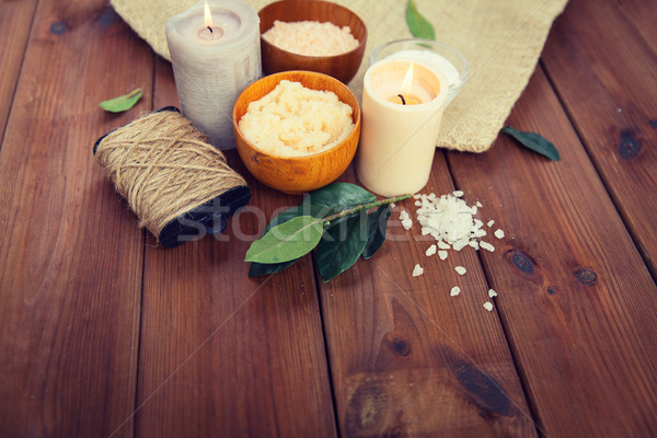 close up of natural body scrub and candles on wood Stock photo © dolgachov