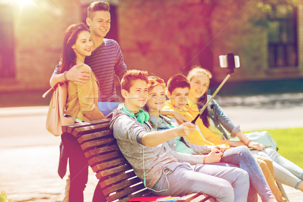 happy teenage students taking selfie by smartphone Stock photo © dolgachov