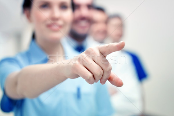 close up of doctor pointing finger at hospital Stock photo © dolgachov