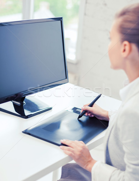 businesswoman with drawing tablet in office Stock photo © dolgachov