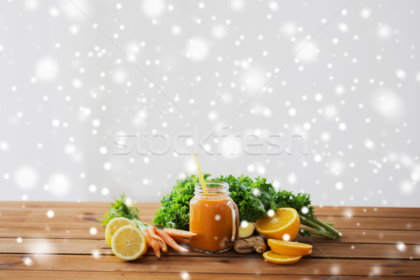 glass jug of carrot juice, fruits and vegetables Stock photo © dolgachov
