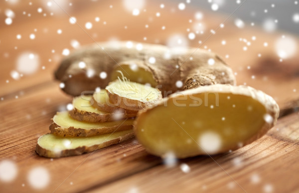 close up of ginger root on wooden table Stock photo © dolgachov