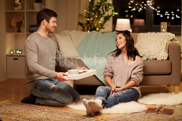happy couple with food on tray at home Stock photo © dolgachov