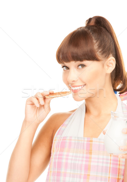 housewife with milk and cookies Stock photo © dolgachov