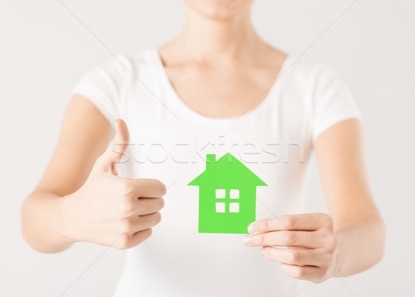 woman hands holding green house Stock photo © dolgachov