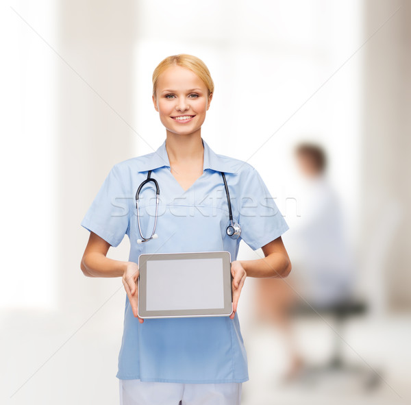 smiling female doctor or nurse with tablet pc Stock photo © dolgachov