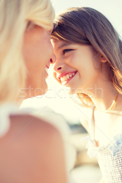 happy mother and child girl outdoors Stock photo © dolgachov