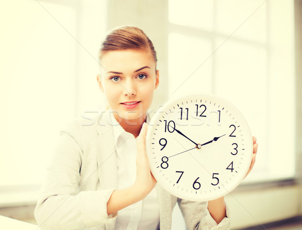 Atraente empresária branco relógio quadro Foto stock © dolgachov
