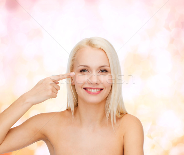 beautiful woman touching her eye area Stock photo © dolgachov