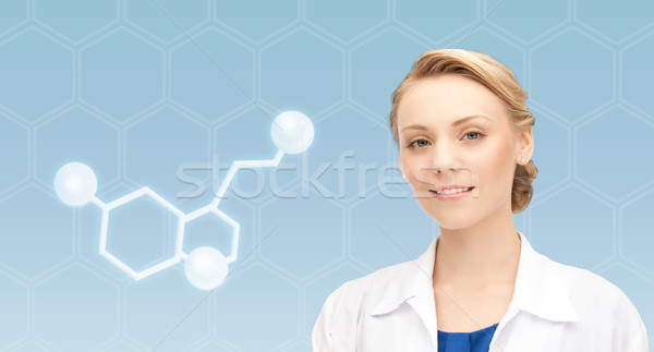 smiling female doctor with molecule of serotonin Stock photo © dolgachov
