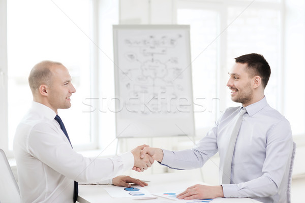 Сток-фото: два · улыбаясь · бизнесменов · рукопожатием · служба · бизнеса