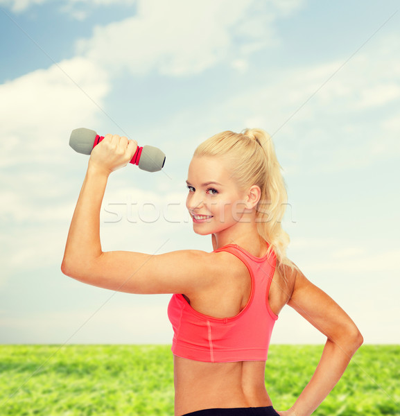 young sporty woman with light dumbbell Stock photo © dolgachov