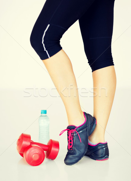 sporty woman legs with light red dumbbells Stock photo © dolgachov