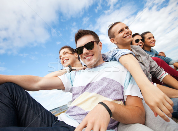 group of teenagers hanging out Stock photo © dolgachov