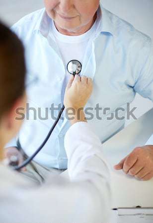 close up of doctor measuring blood pressure Stock photo © dolgachov
