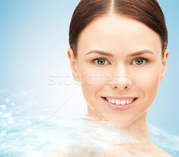 face of beautiful young woman and water splash Stock photo © dolgachov