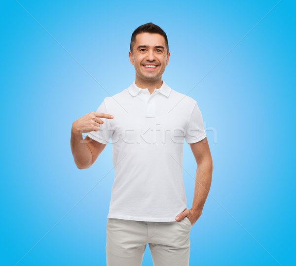 smiling man in t-shirt pointing finger on himself Stock photo © dolgachov