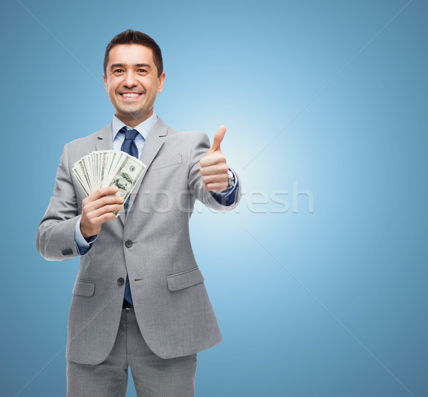 Sorridente empresário dinheiro pessoas de negócios Foto stock © dolgachov