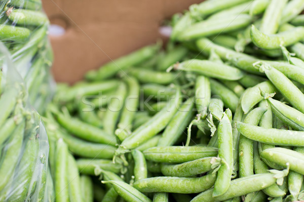 close up of green peas in box at street market Stock photo © dolgachov