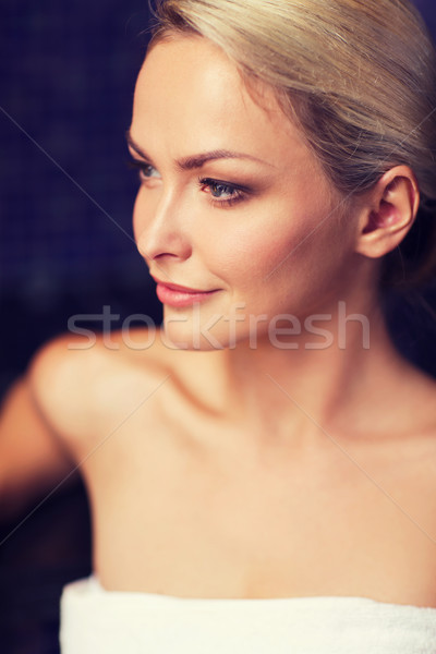 close up of young woman sitting in bath towel Stock photo © dolgachov