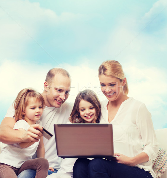 happy family with laptop computer and credit card Stock photo © dolgachov