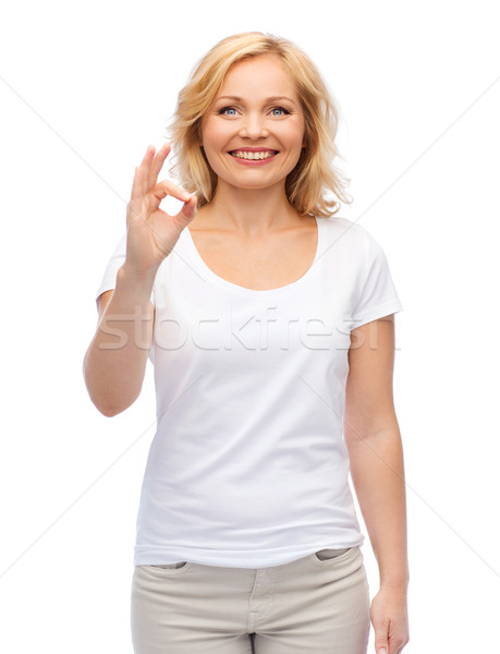 Stock photo: happy woman in white t-shirt showing ok hand sign