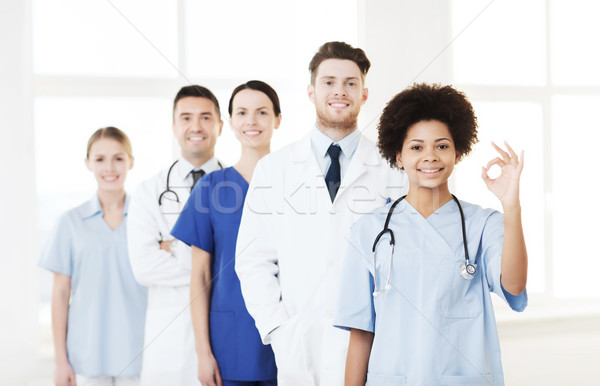 group of happy doctors at hospital Stock photo © dolgachov