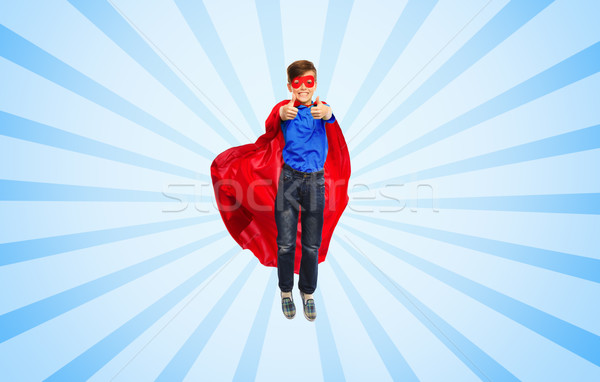 boy in super hero cape and mask showing thumbs up Stock photo © dolgachov