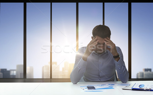 close up of anxious businessman with papers Stock photo © dolgachov