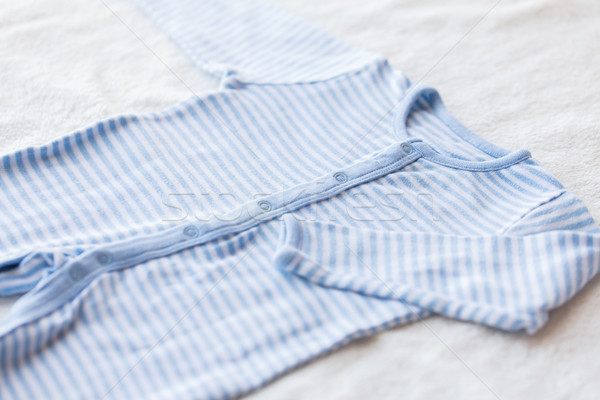 close up of baby bodysuit for newborn boy on towel Stock photo © dolgachov