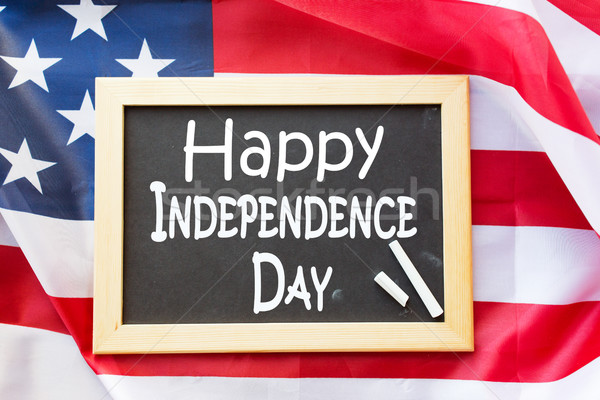 blackboard ands american flag on independence day Stock photo © dolgachov
