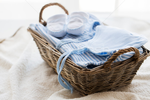 close up of baby clothes for newborn boy in basket Stock photo © dolgachov