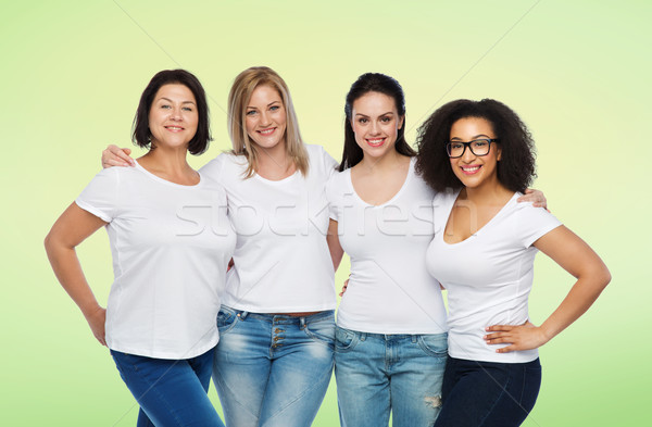 group of happy different women in white t-shirts Stock photo © dolgachov