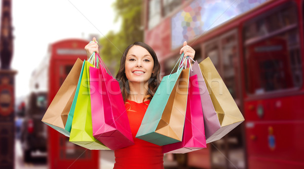 woman with shopping bags over london city street Stock photo © dolgachov