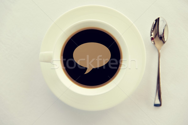 cup of black coffee with text bubble and spoon Stock photo © dolgachov