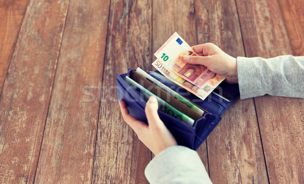 Közelkép nő kezek pénztárca Euro pénz Stock fotó © dolgachov
