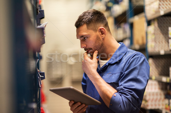 auto mechanic or smith with tablet pc at workshop Stock photo © dolgachov