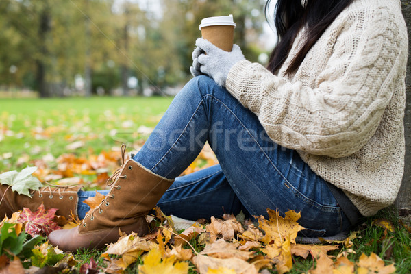 close up of  woman drinking coffee in autumn park Stock photo © dolgachov