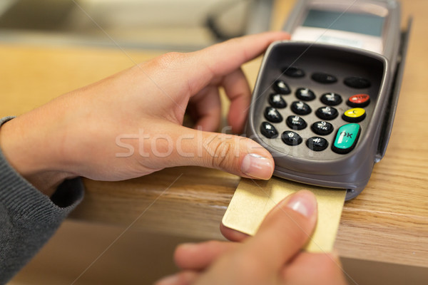 close up of hand inserting bank card to terminal Stock photo © dolgachov