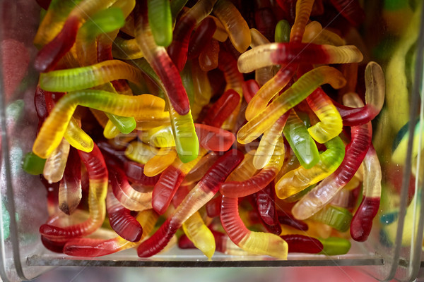 close up of gummy worms in box at candy shop Stock photo © dolgachov