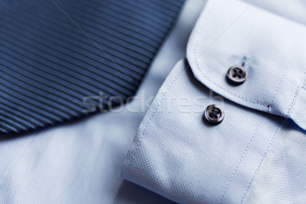 Stock photo: close up of shirt and blue patterned tie