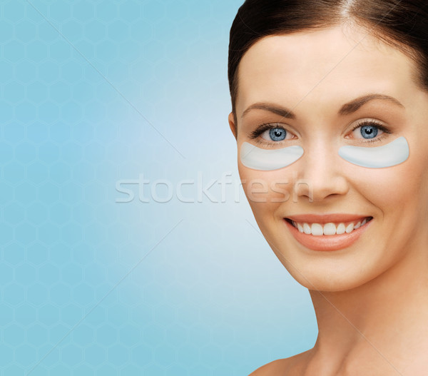 close up of woman face with under-eye patches Stock photo © dolgachov
