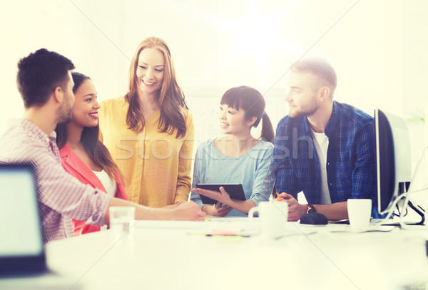 happy creative team or students working at office Stock photo © dolgachov
