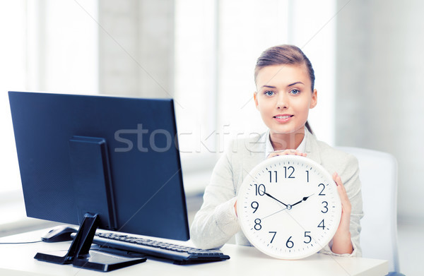 attractive businesswoman with white clock Stock photo © dolgachov