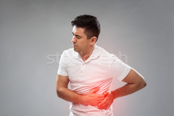 Nieszczęśliwy człowiek cierpienie ból brzucha ludzi opieki zdrowotnej Zdjęcia stock © dolgachov