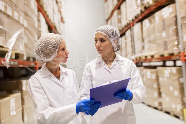 women technologists at ice cream factory warehouse Stock photo © dolgachov