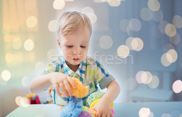 happy little baby boy with ball clay at home Stock photo © dolgachov