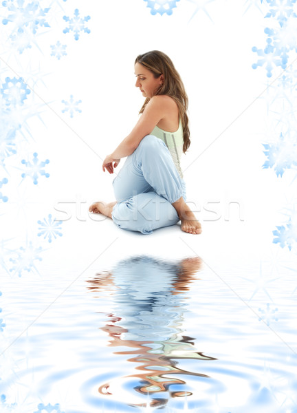 Stock photo: half lord of the fishes pose on white sand
