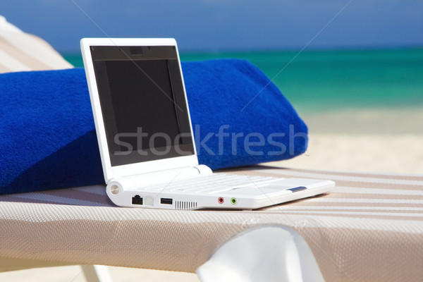 laptop and towel on the beach chaise longue Stock photo © dolgachov