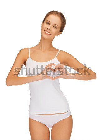 woman in cotton undrewear forming heart shape Stock photo © dolgachov